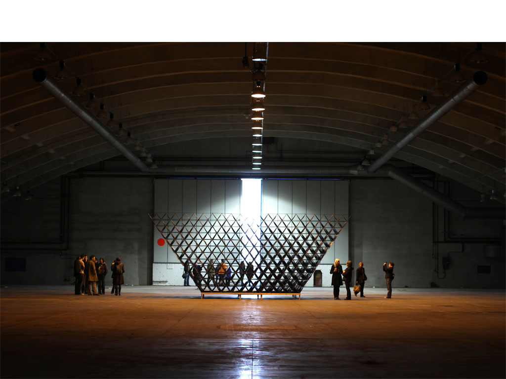 <b><i>Image:</i></b> <i>Blue Bell Hangar</i>, an experimental sculpture by New British Art installed in the Blue Bell Hangar, St Athan former military airbase, Vale of Glamorgan, 2011 © New British Art