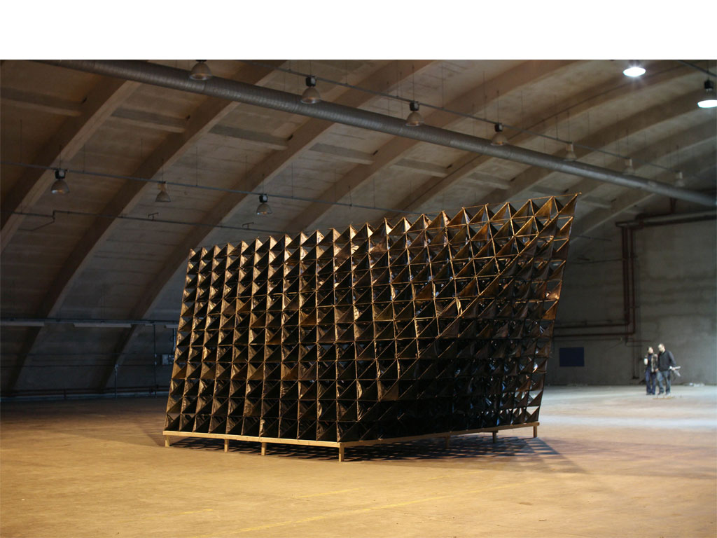 <b><i>Image:</i></b> <i>Blue Bell Hangar</i>, an experimental sculpture by New British Art installed in the Blue Bell Hangar, St Athan former military airbase, Vale of Glamorgan, 2011 © New British Art