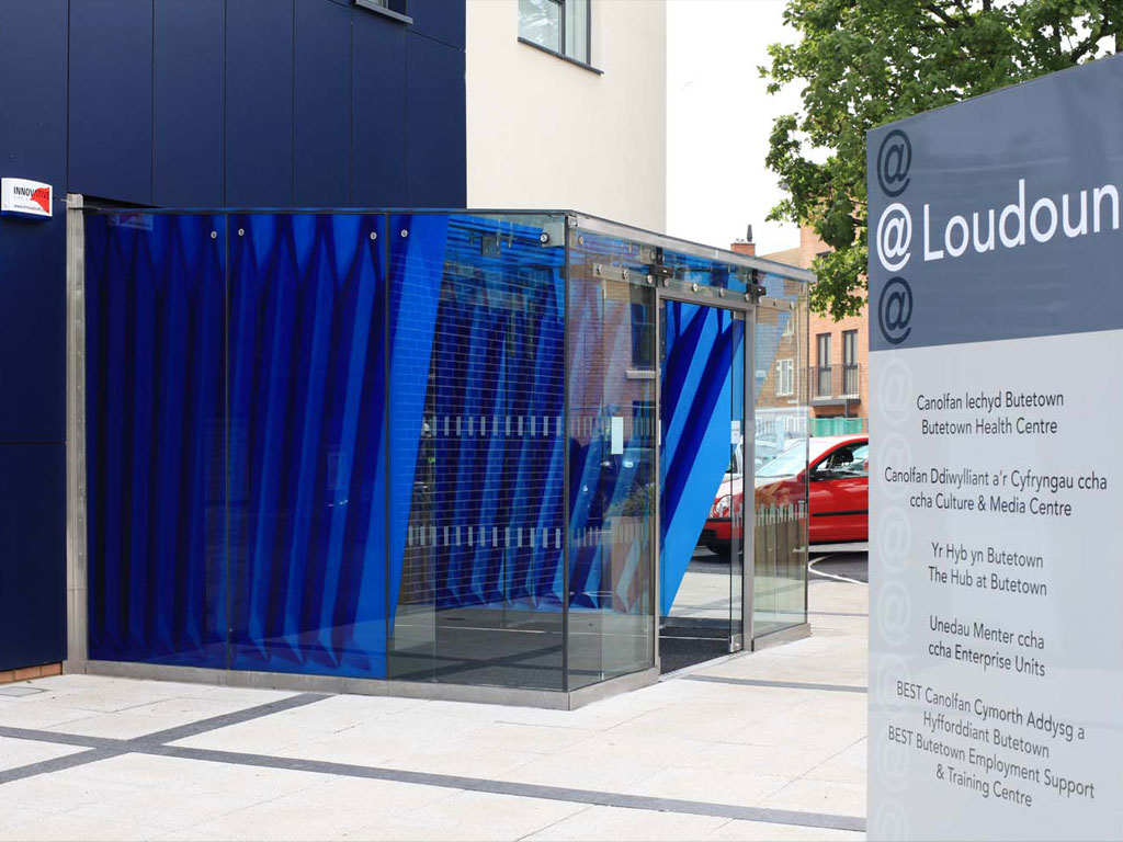 <i><b>Image:</b></i> <i>Fold</i>, a screen-printed enamel application to the glass cube entrance way of @Loudoun Square, Anna Heinrich & Leon Palmer, 2012 © Heinrich & Palmer