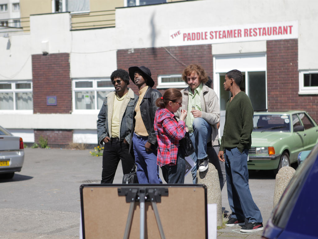 <i><b>Image:</b></i> <i>Statues</i>, a participatory film project produced by Janet Hodgson with Butetown Residents @Loudoun Square, Butetown, Cardiff, 2012.  Photograph by Victoria Rodway © CCHA