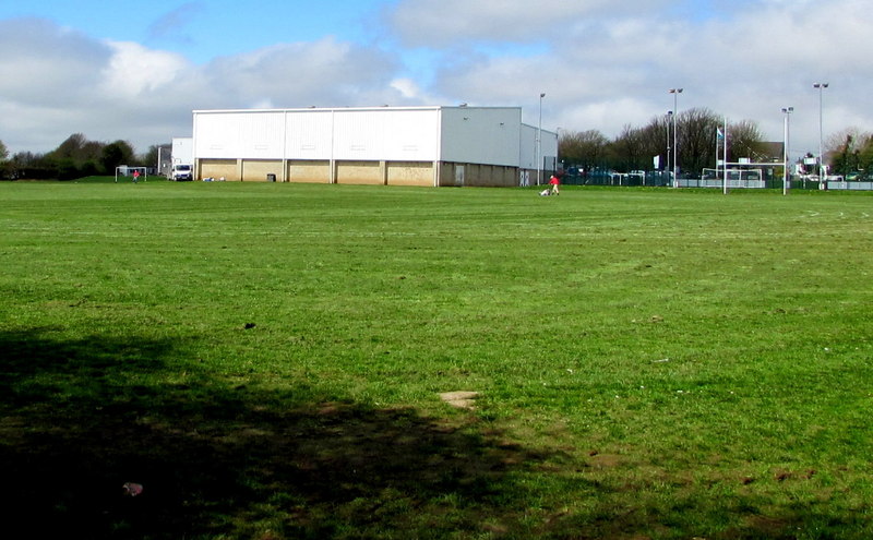 <i><b>Image:</b> South side of Bishopston Comprehensive School for SS5889 Viewed across a sports field from this Link public footpath gate.</i>